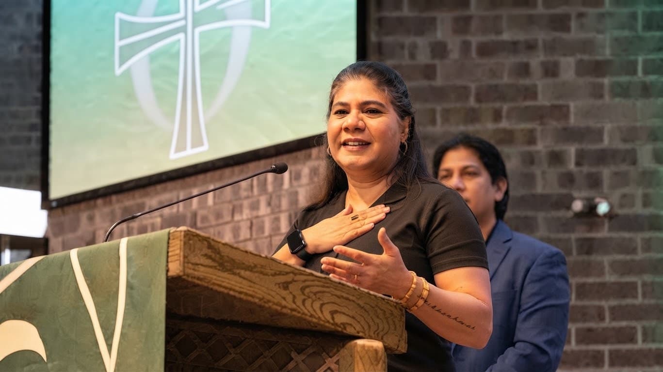Ruby Naeem John speaking at a church lectern